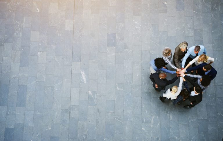 Group of professionals joining hands